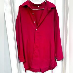 Large button up dress with shorts.